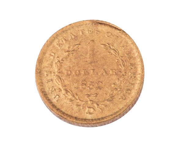 istock one gold 1852 dollar coin isolated on white background 1146439114