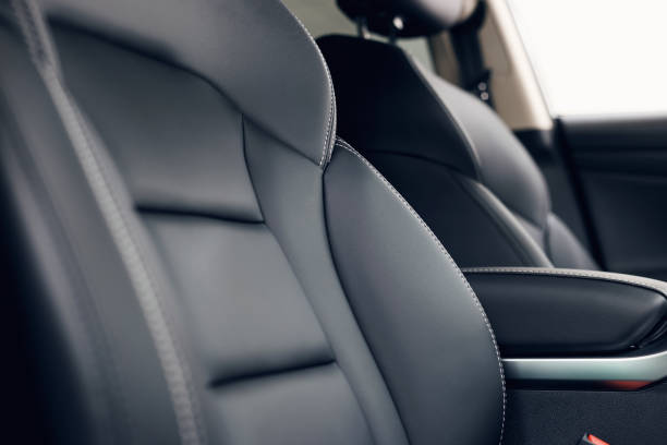 istock Leather car interior. Modern car illuminated dashboard. Luxurious car instrument cluster. Close up shot of automobile instrument panel. Modern car interior dashboard and steering wheel 1146439274