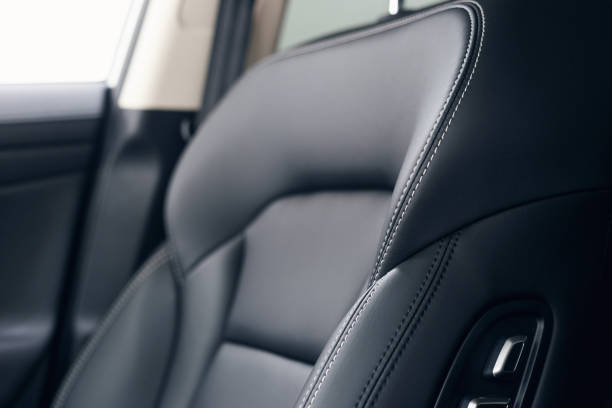 istock Leather car interior. Modern car illuminated dashboard. Luxurious car instrument cluster. Close up shot of automobile instrument panel. Modern car interior dashboard and steering wheel 1146440391