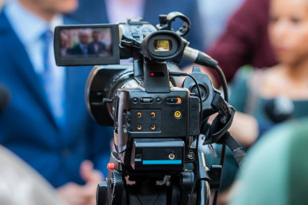 istock Camera Filming Interview In City 1146440470