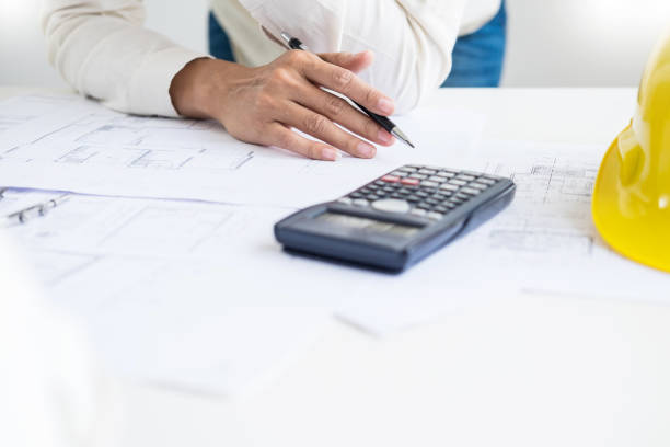 istock Close-Up Of Architect Making Blueprint In Office 1146441964