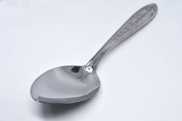 Retro style spoon Vintage spoon on a white background baby spoon stock pictures, royalty-free photos & images
