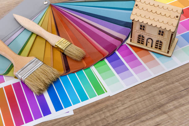 istock Brushes and paint color palette samples on wooden background, closeup 1146448144