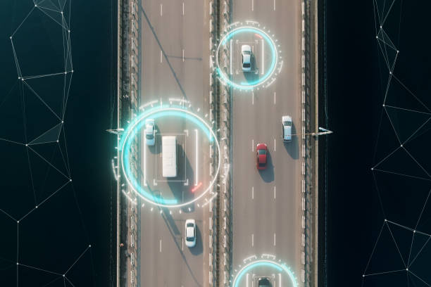 4k aerial view of self driving autopilot cars driving on a highway with technology tracking them, showing speed and who is controlling the car. Visual effects clip shot. stock photo