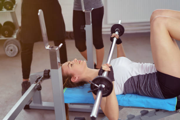 istock Young woman working out with weights 1146449545
