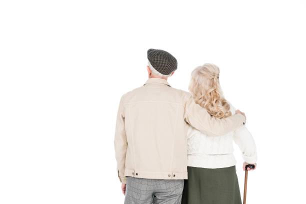 istock back view of retired couple standing isolated on white 1146449653