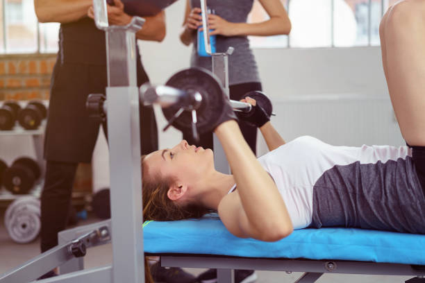 istock Young woman doing bodybuilding lifting weights 1146449673