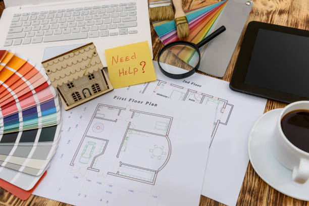 istock Top view at house plan and laptop with color sampler 1146449688