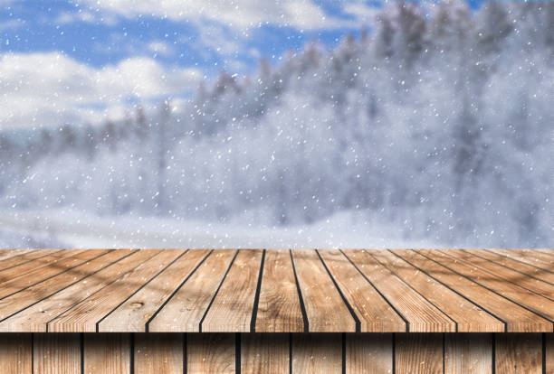 istock old wooden table place with snow place winter background 1146450773