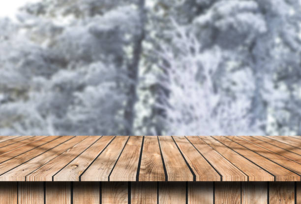 istock old wooden table place with snow place winter background 1146450784
