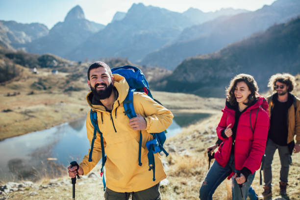 istock Group of hikers walking on a mountain at autumn day 1146450905