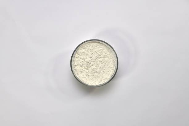 istock White wheat flour in a round cup on a light background. 1146451488
