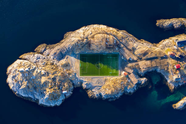 Football in Norway - Henningsvaer Football Field - Lofoten Islands, Norway HENNINGSVAER, NORWAY - April 08, 2019:  Football Field of Henningsvaer fishing village, Norway lofoten photos stock pictures, royalty-free photos & images