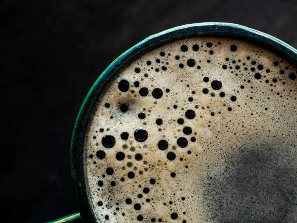 istock Top view hot coffee in green cup on wood background 1146452671
