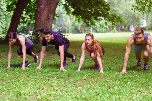istock Four young people crouched in the starter position 1146452690
