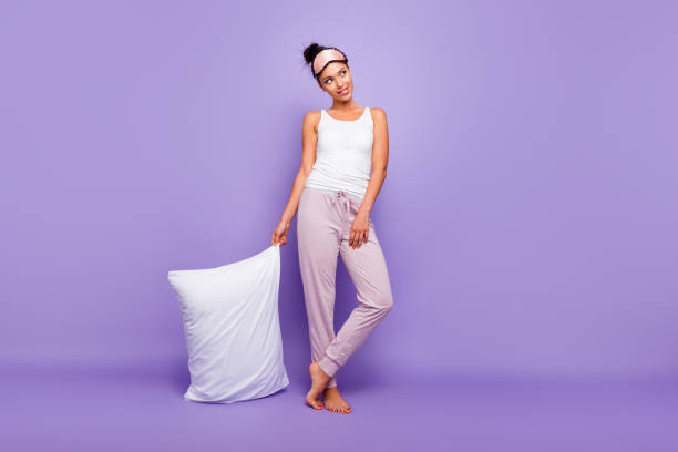 Full length body size photo beautiful she her lady look empty space wondered thoughtful hold hand arm pillow barefoot wear sleeping mask pants tank-top pajamas isolated violet purple background Full length body size photo beautiful she her lady look empty space wondered thoughtful hold hand arm pillow barefoot wear sleeping mask pants tank-top pajamas isolated violet purple background. hair on pillow stock pictures, royalty-free photos & images