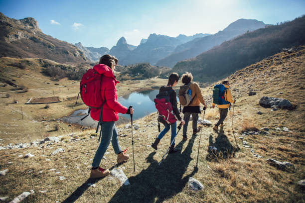 istock Group of hikers walking on a mountain at autumn day 1146454892