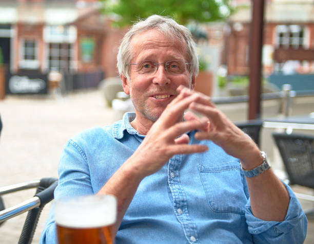 man drinking beer stock photo