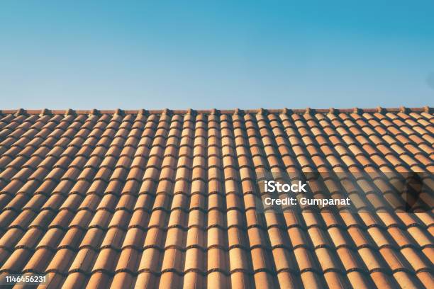 Orange Roof Tile House Against Blue Sky And Warm Sunlight At The Summer Time Housing And Real Estate Concept Vintage Photo And Film Style Stock Photo - Download Image Now