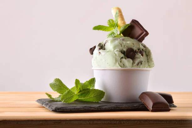 istock Mint and choco ice cream cup decorated with leaves 1146456423
