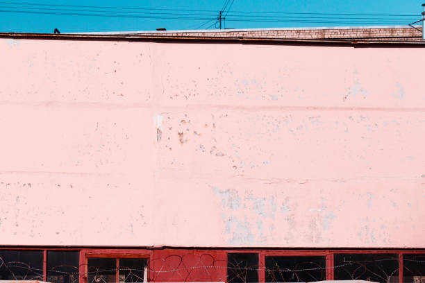 istock Pink textured concrete wall of an old building. 1146456508