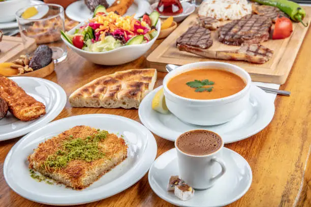 Turkish cuisine; It's also Ramadan 'Iftar'.The meal eaten by Muslims after sunset during Ramadan. Assorted of Turkish oriental dishes. Grilled mixed meat in restaurant.