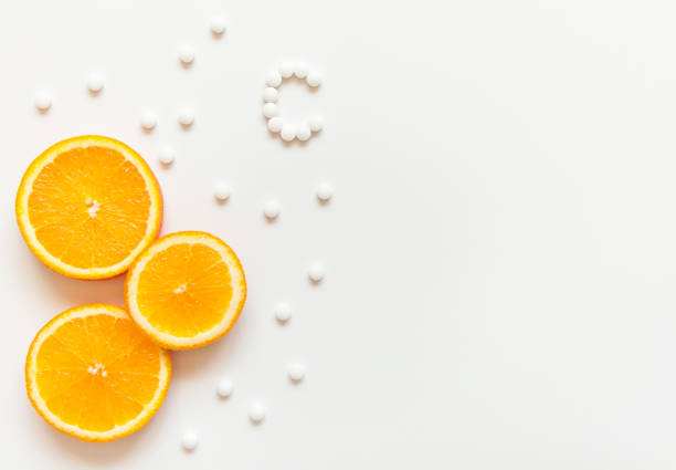 slices of orange on a white background. - vitamin a letter a food orange imagens e fotografias de stock