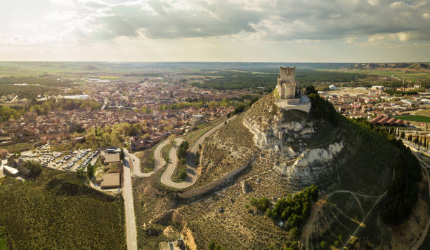 Aerial view of the Castle of Peñafiel in Valladolid Aerial view of the famous castle of Peñafiel in Valladolid at dusk, with the old village and wine cellars in the background. artillery photos stock pictures, royalty-free photos & images
