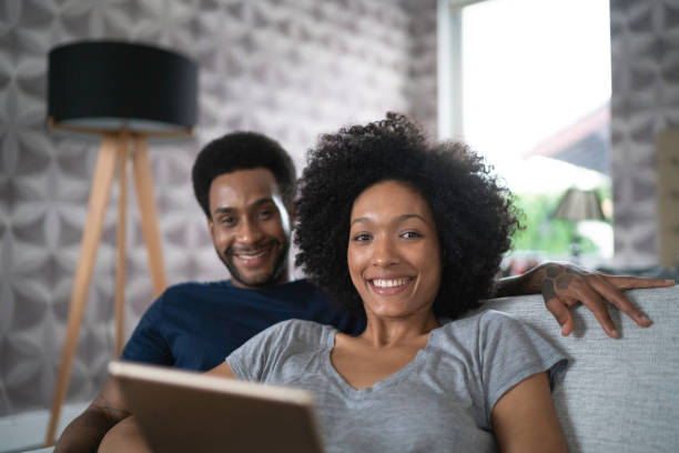 istock Couple sharing a digital tablet in bed 1146465410