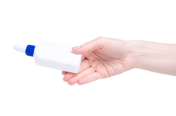 istock White bottle glue in hand 1146467037