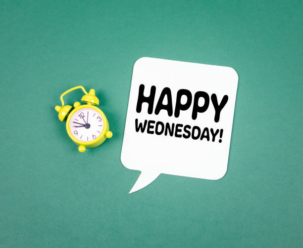 Happy Wednesday. Paper speech bubble and Alarm Clock Happy Wednesday. Paper speech bubble and Alarm Clock on a Green Background wednesday morning stock pictures, royalty-free photos & images