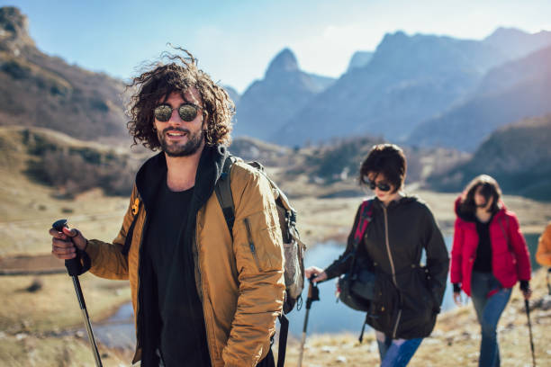 istock Group of hikers walking on a mountain at autumn day 1146467832