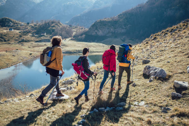 istock Group of hikers walking on a mountain at autumn day 1146468012