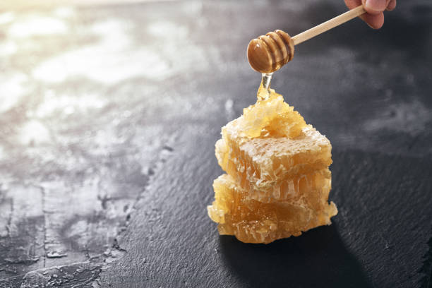 istock Honeycomb and bamboo dipper close-up 1146468114