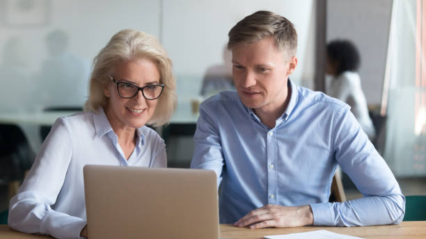 istock Middle aged manager make business offer to client on laptop 1146468304