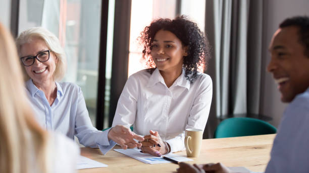 istock Happy diverse employees team talking laughing at corporate group meeting 1146468316