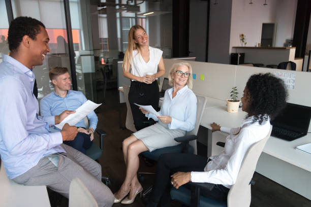 istock Old leader talking to team presenting work plan at meeting 1146468401