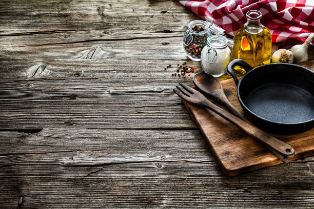 istock Cooking backgrounds: cooking ingredients and utensils on rustic wooden table with copy space 1146469239