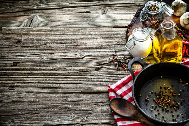 istock Cooking backgrounds: cooking ingredients and utensils on rustic wooden table with copy space 1146469240