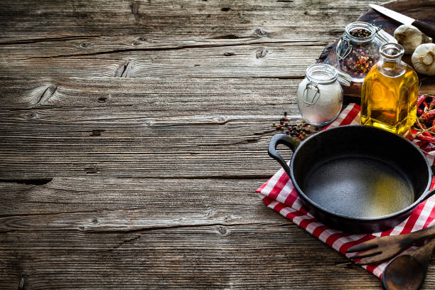 istock Cooking backgrounds: cooking ingredients and utensils on rustic wooden table with copy space 1146469256