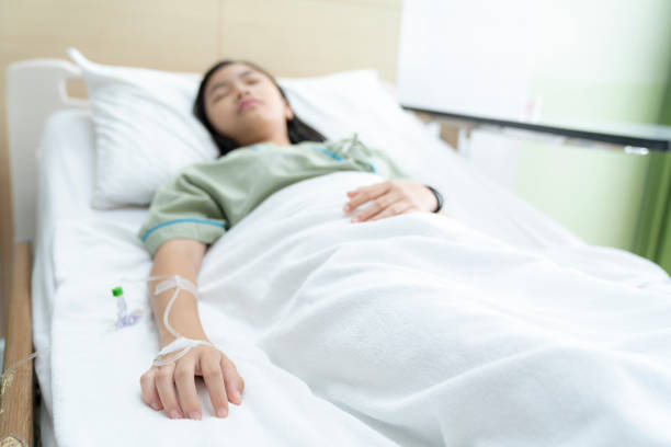 istock Asian lady sleep and patient in hospital with iv solution 1146469263