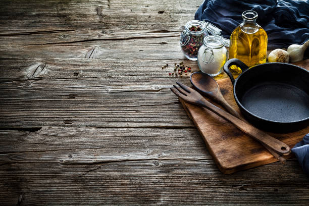 istock Cooking backgrounds: cooking ingredients and utensils on rustic wooden table with copy space 1146469280