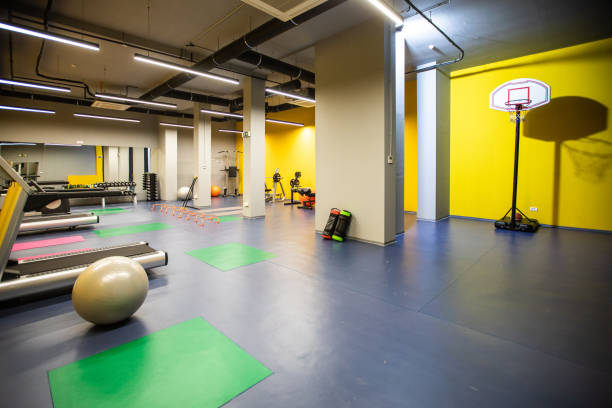 istock Basketball hoop in modern empty gym 1146472748