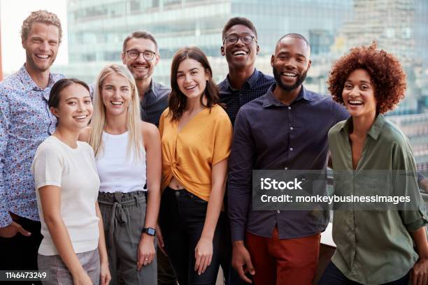 Group Portrait Of A Creative Business Team Standing Outdoors Three Quarter Length Close Up Stock Photo - Download Image Now
