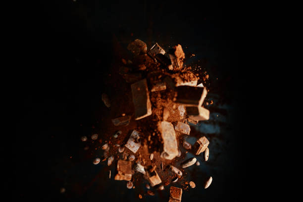 istock Chocolate Food Explosion with Cocoa Powder, Chocolate Chips and Nuts 1146474461