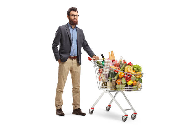 istock Bearded man posing with a loaded shopping cart 1146478743