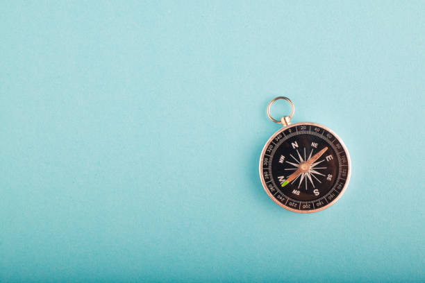 istock compass on blue background for travel or direction concept.copy space for text 1146482541
