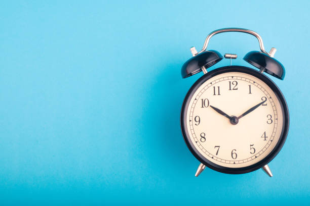 istock Time management concept, alarm clock on blue background. copy space for text 1146482638