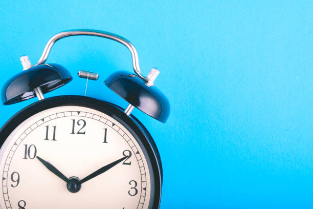 istock Time management concept, alarm clock on blue background. copy space for text 1146482762