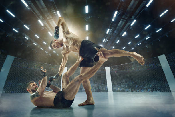 Two professional boxers boxing on the ring